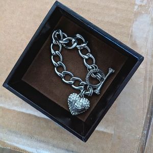 Juicy Couture silver bracelet w/ heart pendant